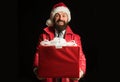 I want to give you your Christmas present. Surprised santa with christmas gift. Royalty Free Stock Photo