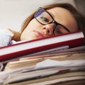 I want to sleep. Young business woman tired from office work wit Royalty Free Stock Photo