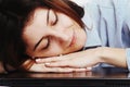 I want to sleep. Young business woman tired from office work wit Royalty Free Stock Photo