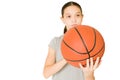 Active preteen playing basketball