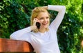 I was waiting your call. Girl blonde smiling face talk smartphone green nature background. Woman having pleasant Royalty Free Stock Photo