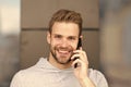 I was waiting for your call. Man beard with smartphone, urban background. Communication concept. Man with beard happy Royalty Free Stock Photo