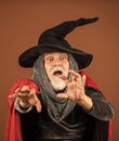 i will catch you. happy halloween. Weird old grandfather with gray beard. Devil man. Holiday and celebration. Magic hat