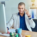 I will email you our latest business reports. a young businessman talking on a cellphone in an office. Royalty Free Stock Photo