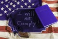 I will not comply gun and Bible on American flag Royalty Free Stock Photo