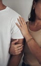 I will stand by him, always. an unrecognizable couple standing close together against a grey wall indoors. Royalty Free Stock Photo