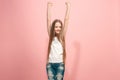 Happy success teen girl celebrating being a winner. Dynamic energetic image of female model Royalty Free Stock Photo