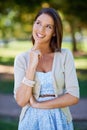 I wonder if i could stay here all day. a beautiful young woman contemplating something while at the park. Royalty Free Stock Photo