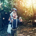 I wont hurt you, I just want to play. two little siblings catching fireflies in jars outside.