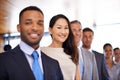 I work with a great team of people. Portrait of an attractive young businesswoman standing amongst her colleagues. Royalty Free Stock Photo