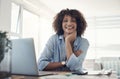 I work hard on my blog and my career. an attractive young woman sitting alone at home and using her laptop. Royalty Free Stock Photo