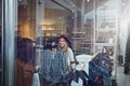 I would so rock this. two best friends out shopping in a clothing store. Royalty Free Stock Photo