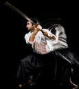 Iaido Kenjutsu budoka man isolated black background