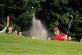 Ian Poulter plays a bunkershot. Royalty Free Stock Photo