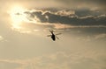 IAR Puma elicopter silhouette flying in the cloudy sky, stunt ae