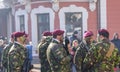 Soldiers in military green uniform marching and celebrating