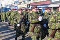 Soldiers in military green uniform marching and celebrating