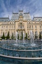 IASI, ROMANIA - 23 MAY 2015: Iasi Cultural Palace being restaurated with a beautiful green park on a sunny spring day with