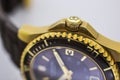 Ibach, Switzerland 31.03.2020 - The close up of Victorinox man watch stainless steel case gold PVD coating swiss quartz