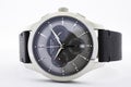 Ibach, Switzerland 31.03.2020 - The close up of Victorinox man watch stainless steel case leather strap grey clock face