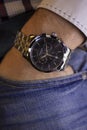 Ibach, Switzerland 31.03.2020 - Closeup fashion image of Victorinox watch on wrist of man: man`s hand in blue jeans