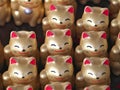 Closeup of Maneki neko or lucky cats or beckoning cats or fortune cats