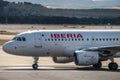 Iberia airplane in airport runway before takeoff
