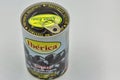 Iberica can of Spanish pitted black olives closeup against white Royalty Free Stock Photo