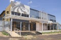 Ibitinga, SP, Brazil - Feb 09 2021: Facade of abandoned college building with wood barricade on the doors