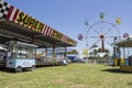 Ibitinga, SP, Brazil - 02 07 2021: Pop corn stand, bumper cars, carousel and big wheel at an amusement park