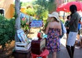 Stall in The Hippy Market in Ibiza and a woman and a man watching the goods Royalty Free Stock Photo