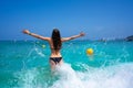 Ibiza beach girl splashing water in Balearics