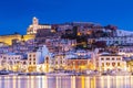 Ibiza Dalt Vila downtown at night with light reflections in the water, Ibiza, Spain.