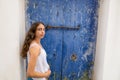 Ibiza Eivissa young girl on blue door Royalty Free Stock Photo