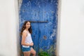 Ibiza Eivissa young girl on blue door Royalty Free Stock Photo