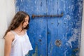 Ibiza Eivissa young girl on blue door Royalty Free Stock Photo