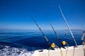 Ibiza fishing boat trolling rods and reels in blue sea