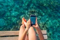 Ibiza girl taking smartphone photos Royalty Free Stock Photo