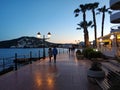 People walking by the seafront of Santa Eulalia. Ibiza Island. S