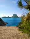 Ibiza and its wonders. the crystal blue sea, the islet of Es Vedra seen from the cliffs of Cala D`Hort in a blue summer tourist