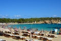 IBIZA, SPAIN - SEPTEMBER 1, 2016: amazing crystalline water of Cala Bassa beach with umbrellas and beach chairs, Ibiza, Spain Royalty Free Stock Photo