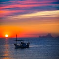 Ibiza sunset Es Vedra view and fisherboat formentera