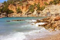 Ibizan beach of cala dhort in the inlet of beach between the rocks of the bay in front of the water of the mediterranean sea