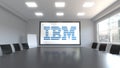 IBM logo on the screen in a meeting room. Editorial 3D rendering Royalty Free Stock Photo