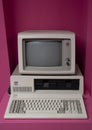 IBM personal computer (1981) is the first microcomputer released in the IBM PC model line. Pink background..