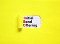 IBO initial bond offering symbol. Concept words IBO initial bond offering on beautiful white paper. Beautiful yellow paper