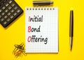 IBO initial bond offering symbol. Concept words IBO initial bond offering on beautiful white note. Beautiful yellow background.