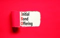 IBO initial bond offering symbol. Concept words IBO initial bond offering on beautiful white paper. Beautiful red paper background