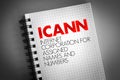 ICANN - Internet Corporation for Assigned Names and Numbers acronym on notepad, technology concept background