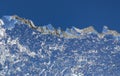 Ice Against The Blue Sky. Mountain Range. A Winter Landscape. A Structure Of The Frozen Water. Abstract Natural Background